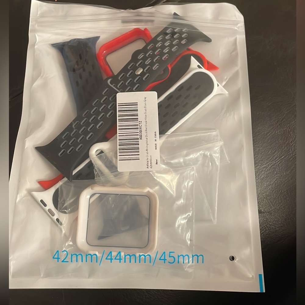 Wrist band and protection for the watch screen in black, red and white.